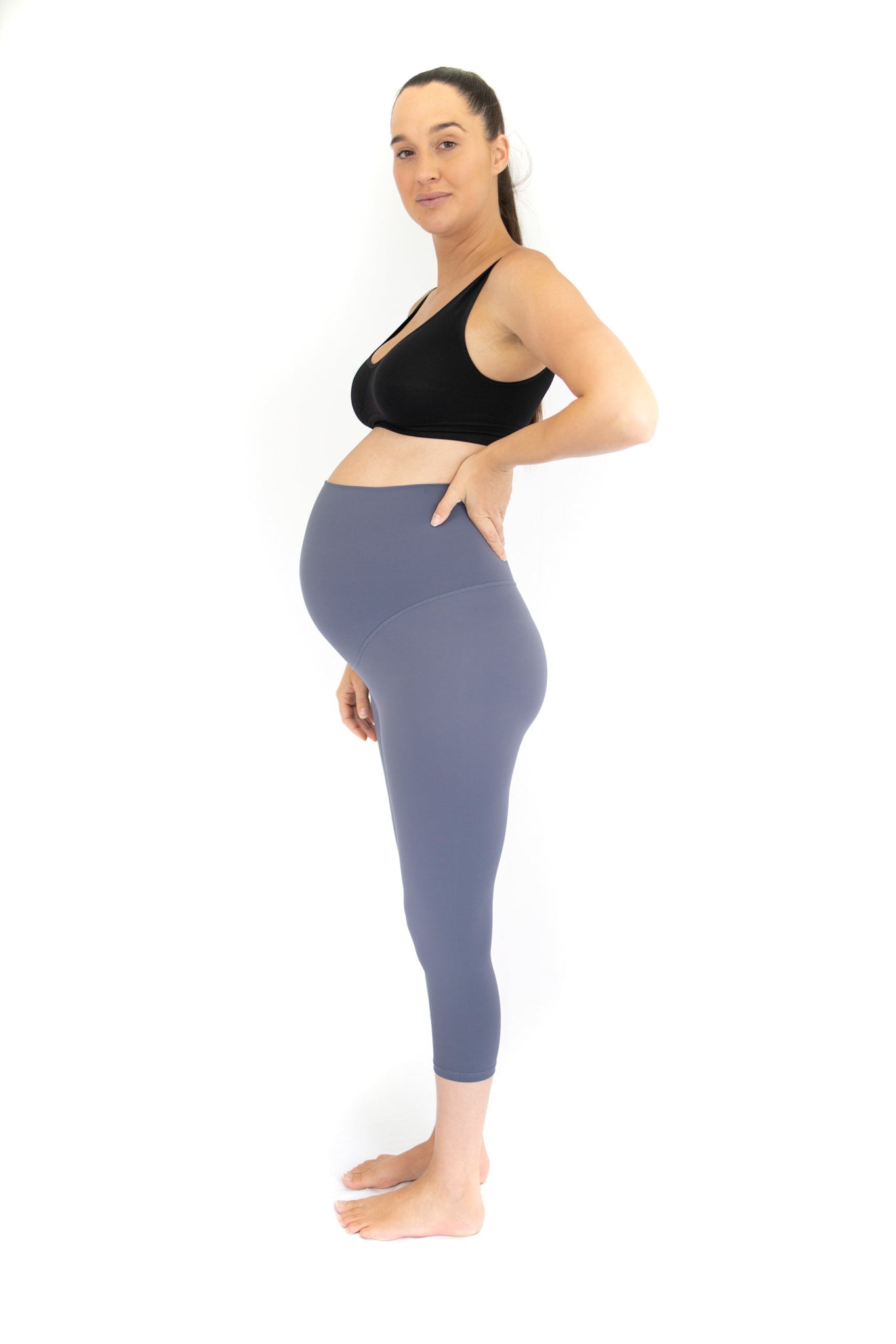 Pregnant woman in black sports bra and gray 3/4 Maternity Leggings - Twilight