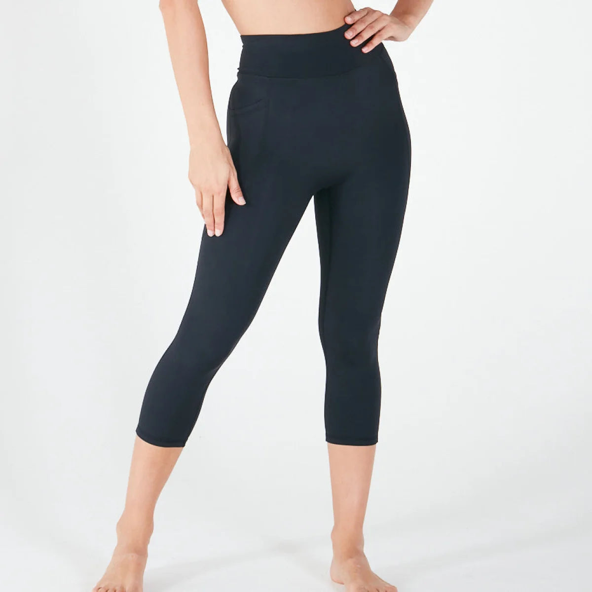 Black high-waisted capri-length leggings featuring pockets, ideal fit everyday leggings