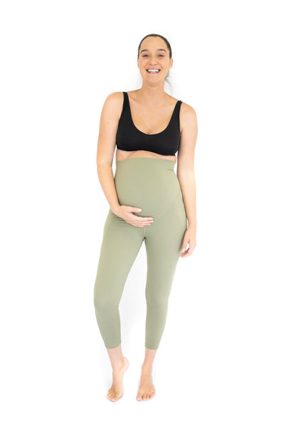 Smiling pregnant woman in emamaco maternity 7/8 Pocket Maternity Leggings - Olive