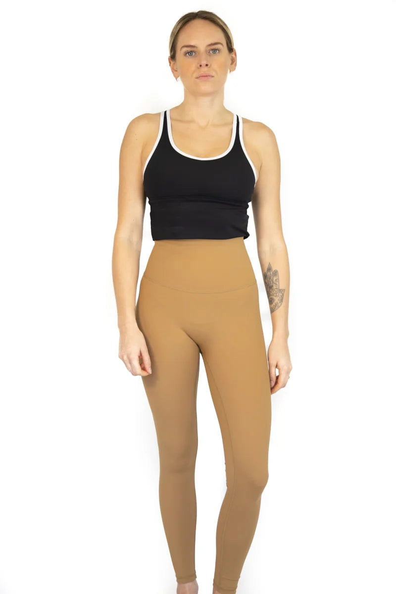 Woman in black crop top and tan leggings, 7/8 Shaper Move Leggings - Caramel, final sale