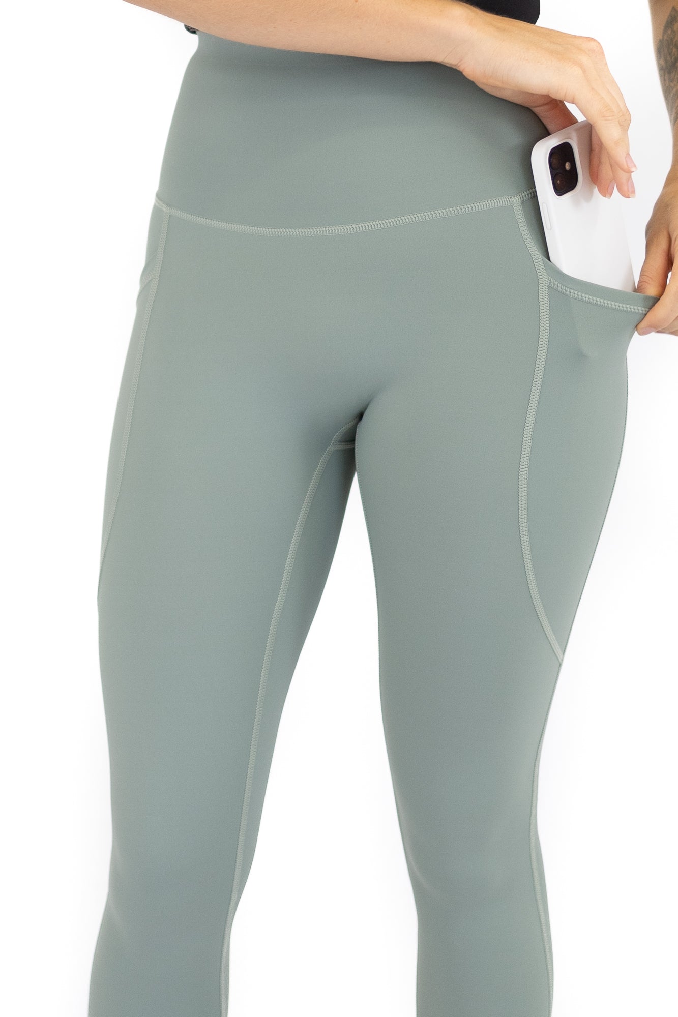 Pale green high-waisted leggings with side pocket on final sale, limited sizes remaining