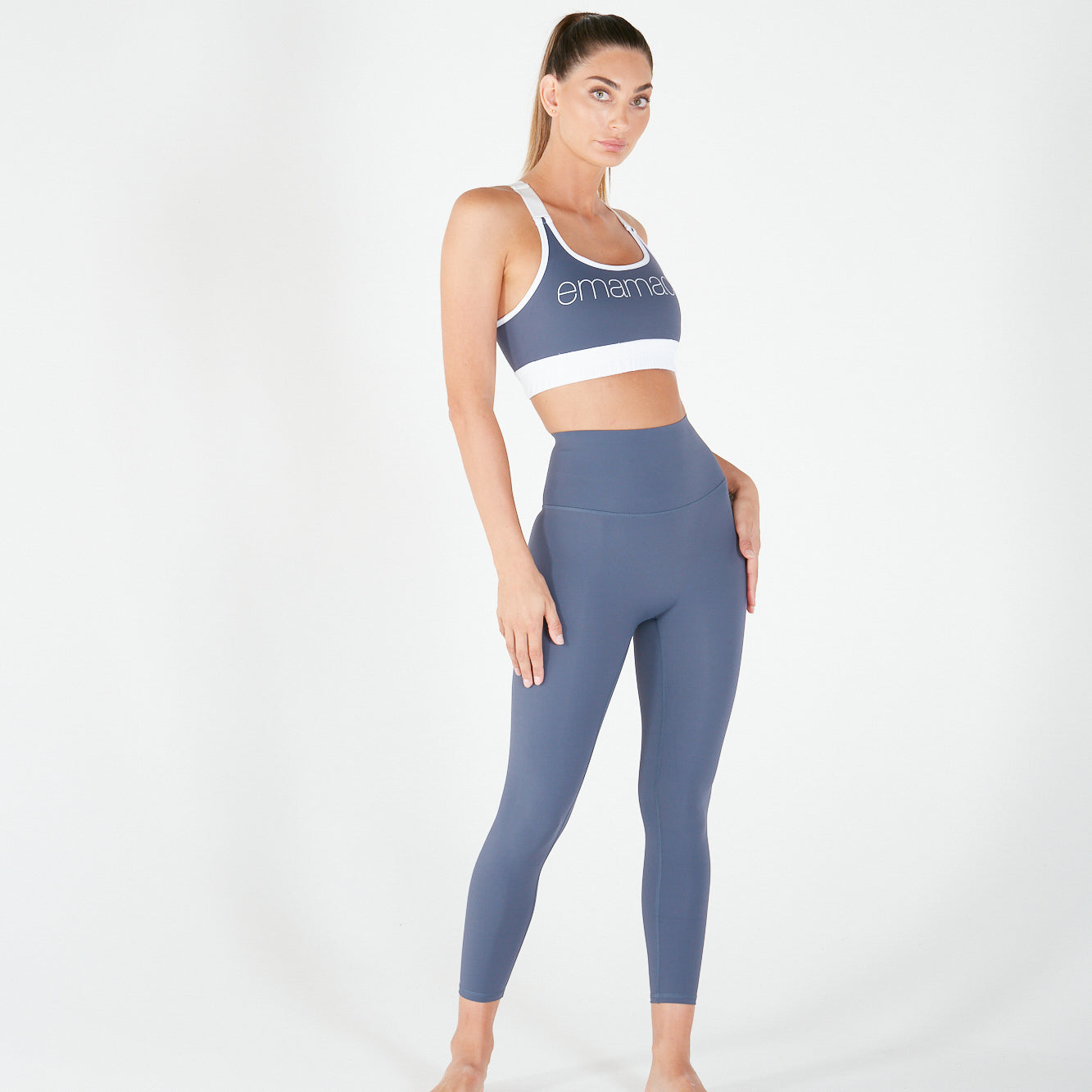 Woman in blue-gray activewear showcasing 7/8 Shaper Move Leggings - Twilight