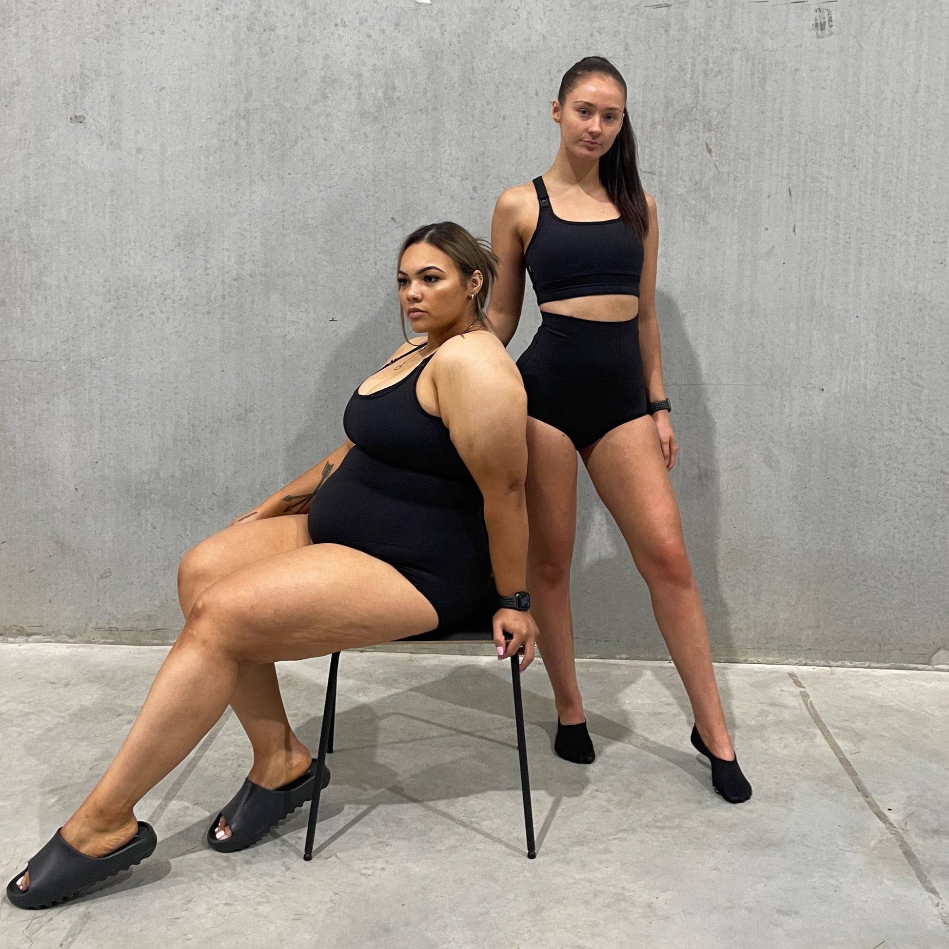 Two women in black athletic wear showcasing Emama High Waist Body Shapewear Brief