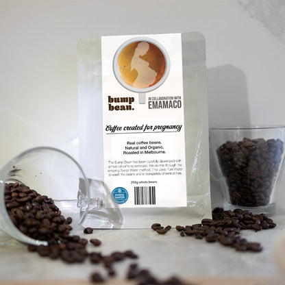 Bump Bean coffee package for pregnancy with scattered coffee beans around it