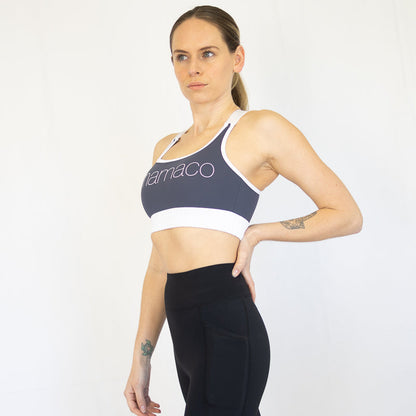 Woman in Navy Blue Elevate Nursing Sports Bra and Black Leggings for Activewear