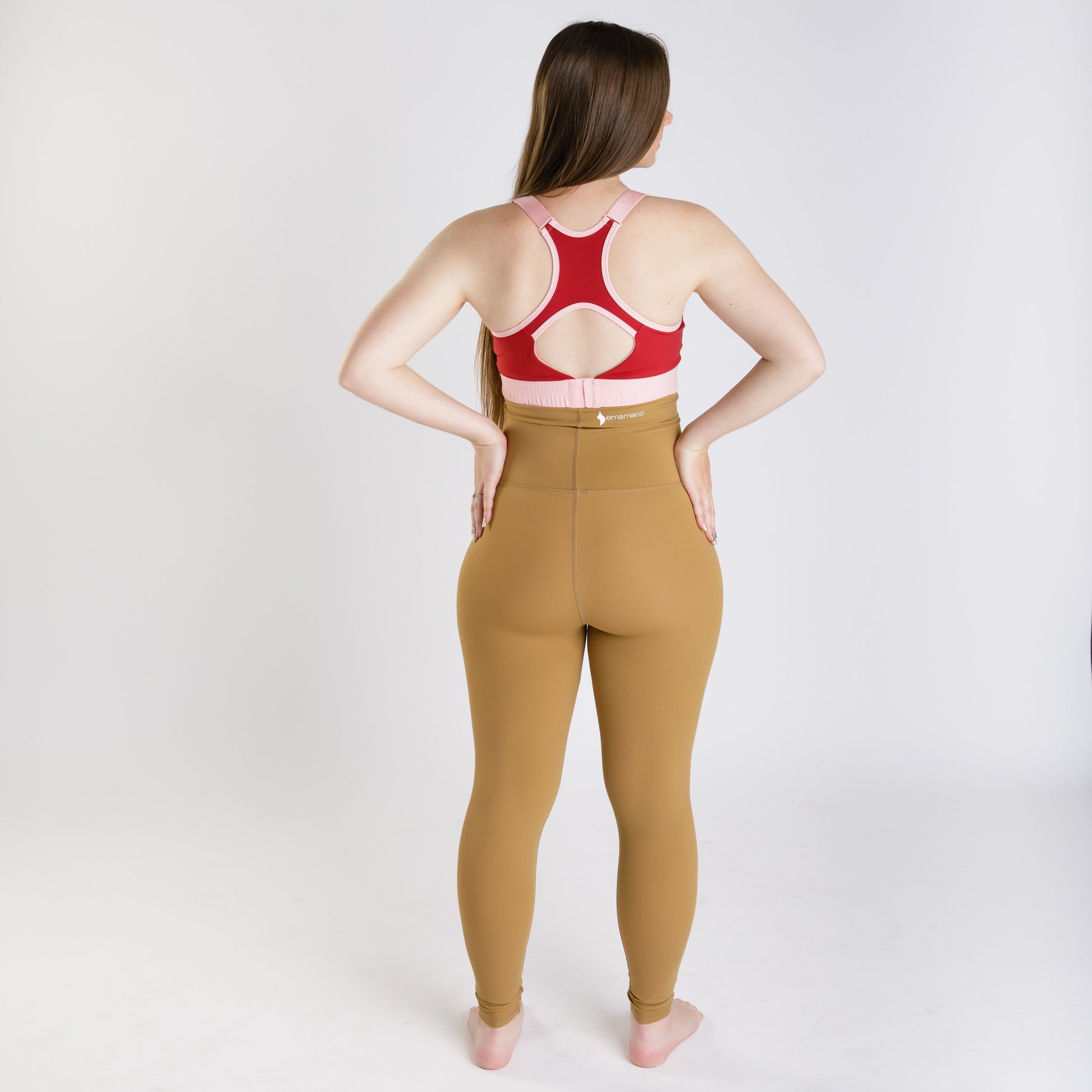 Woman in Emama Maternity Leggings viewed from behind, showcasing caramel color on final sale