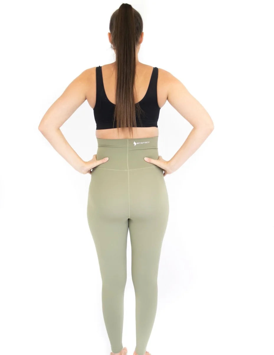 Woman wearing Emama Maternity Leggings in olive, showcasing a stylish back view