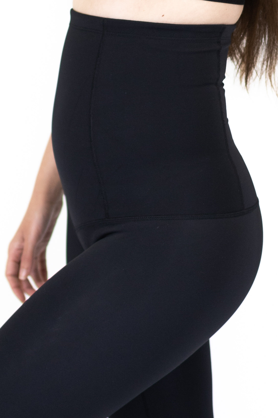 High-waisted black leggings for pregnancy recovery and post partum comfort