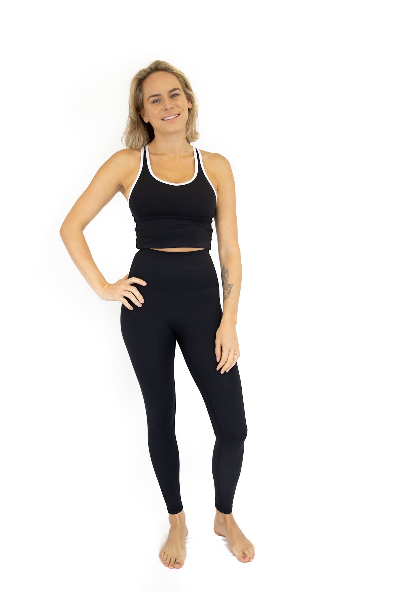 Woman in black activewear crop top and leggings showcasing Shaper Move Leggings