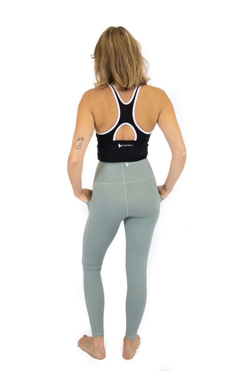 Woman in Spearmint Shaper Move Leggings, showcasing final sale with limited sizes remaining