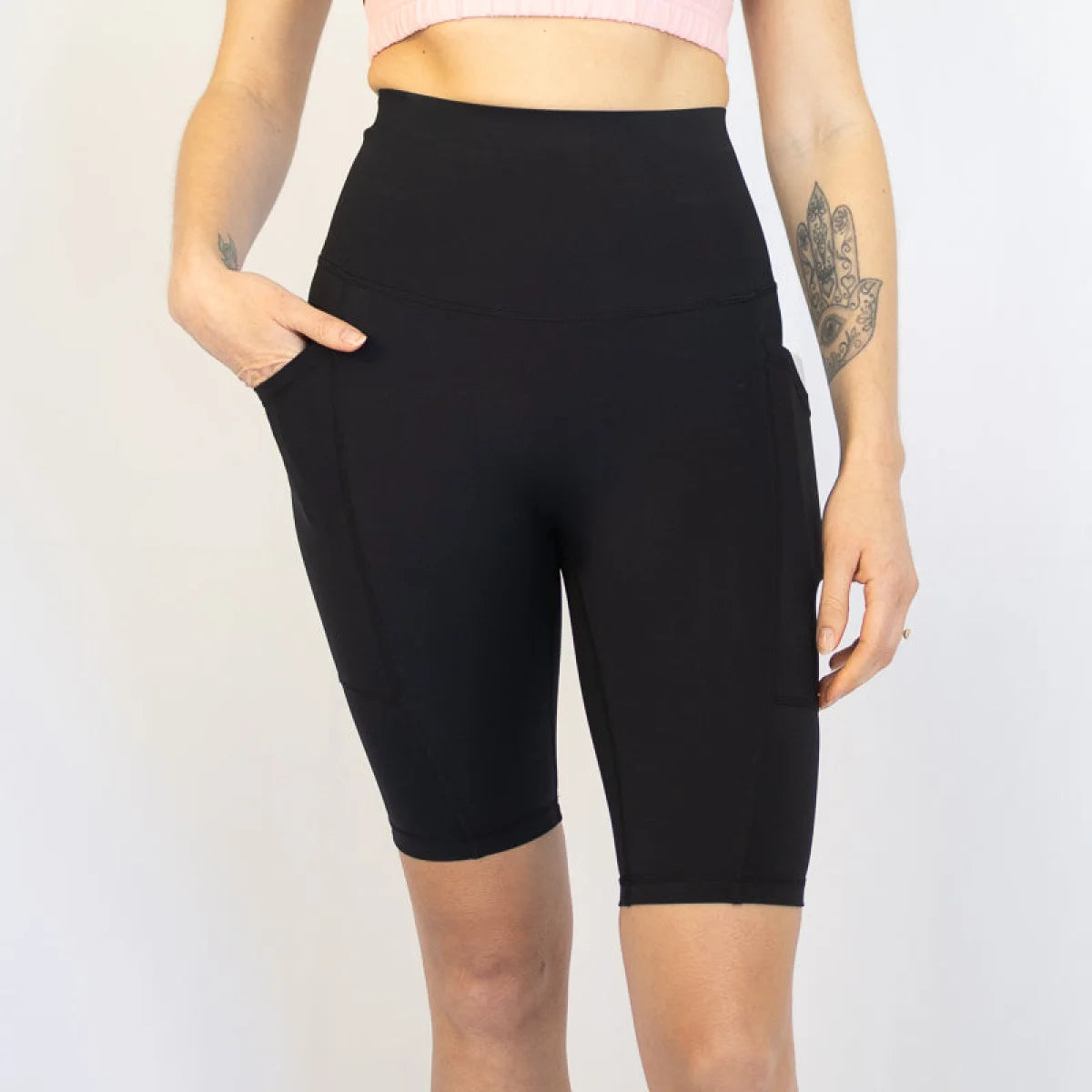 Black high-waisted biker shorts with pockets ideal for maternity and pet hair resistance