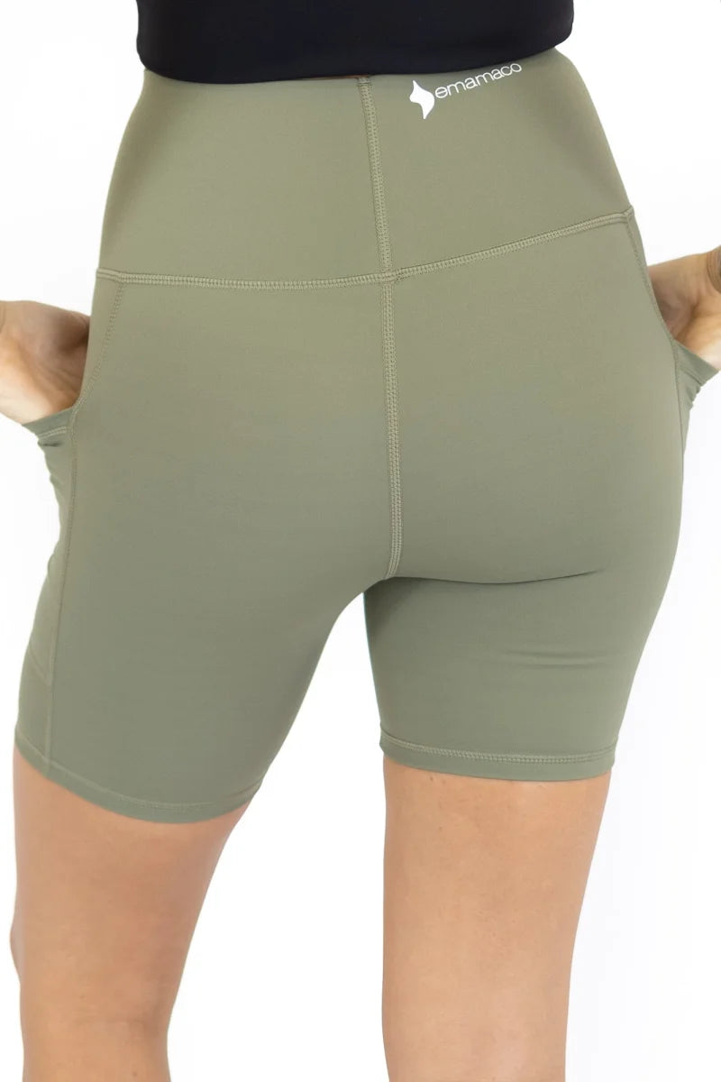 Olive green high-waisted workout shorts with pockets on final sale, limited sizes remaining